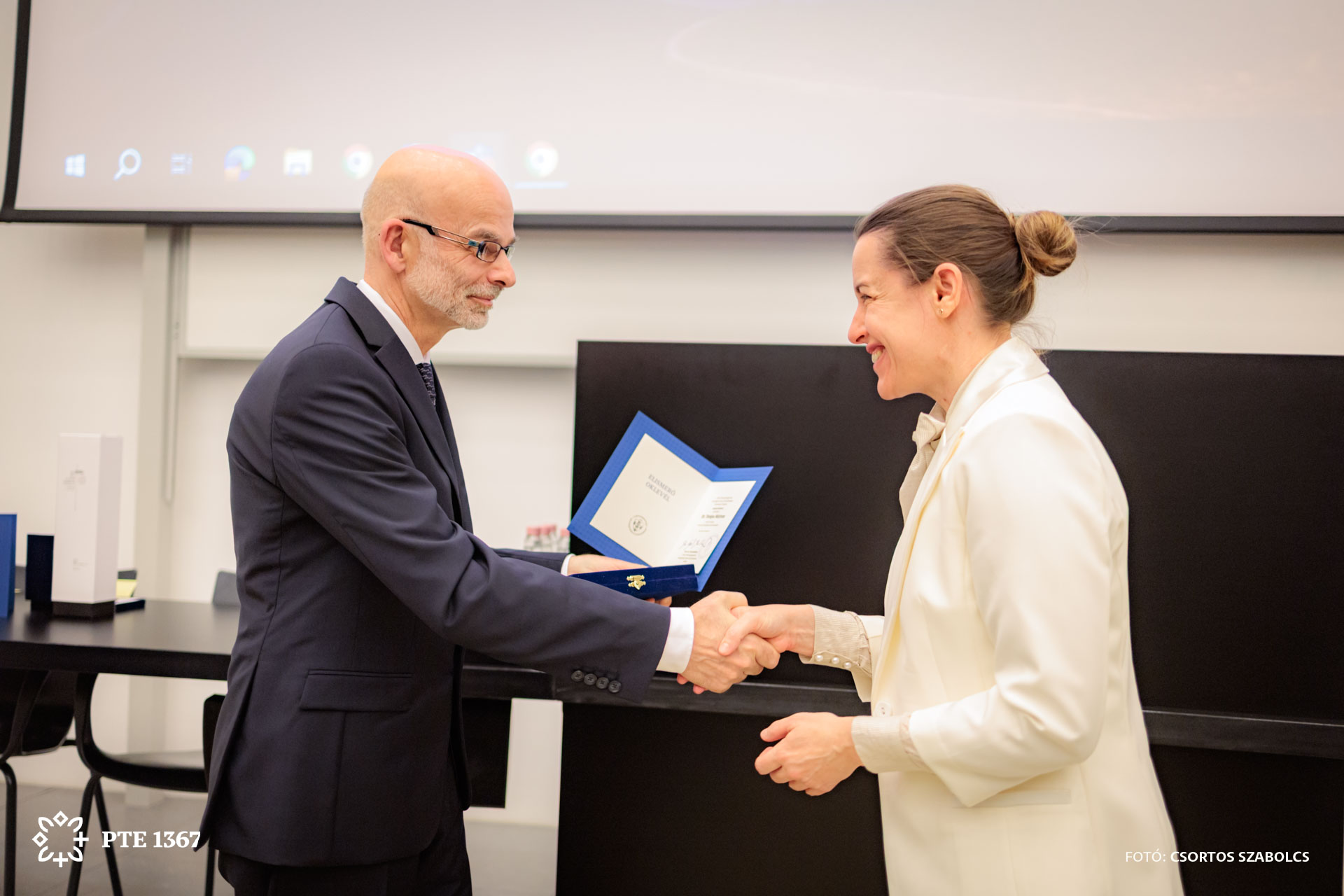 Dr. Katalin Gombos receives her award at the Szentágothai day